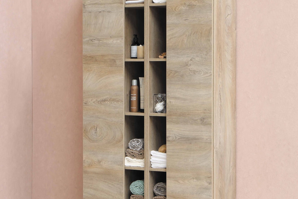 Neatly organised wardrobe with folded clothes and storage boxes